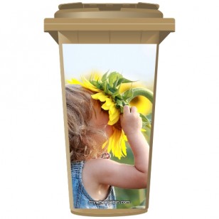 Young Girl Sniffing A Sunflower Wheelie Bin Sticker Panel